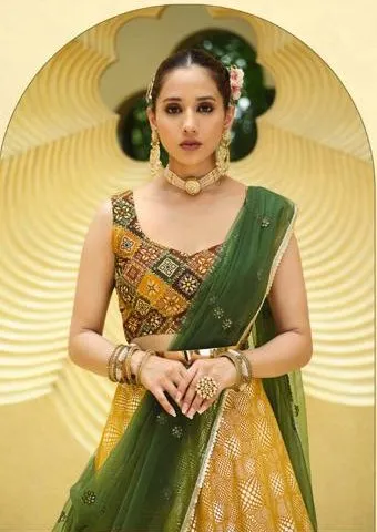 Beautiful Yellow and Green colored printed Lehenga Set - Rent