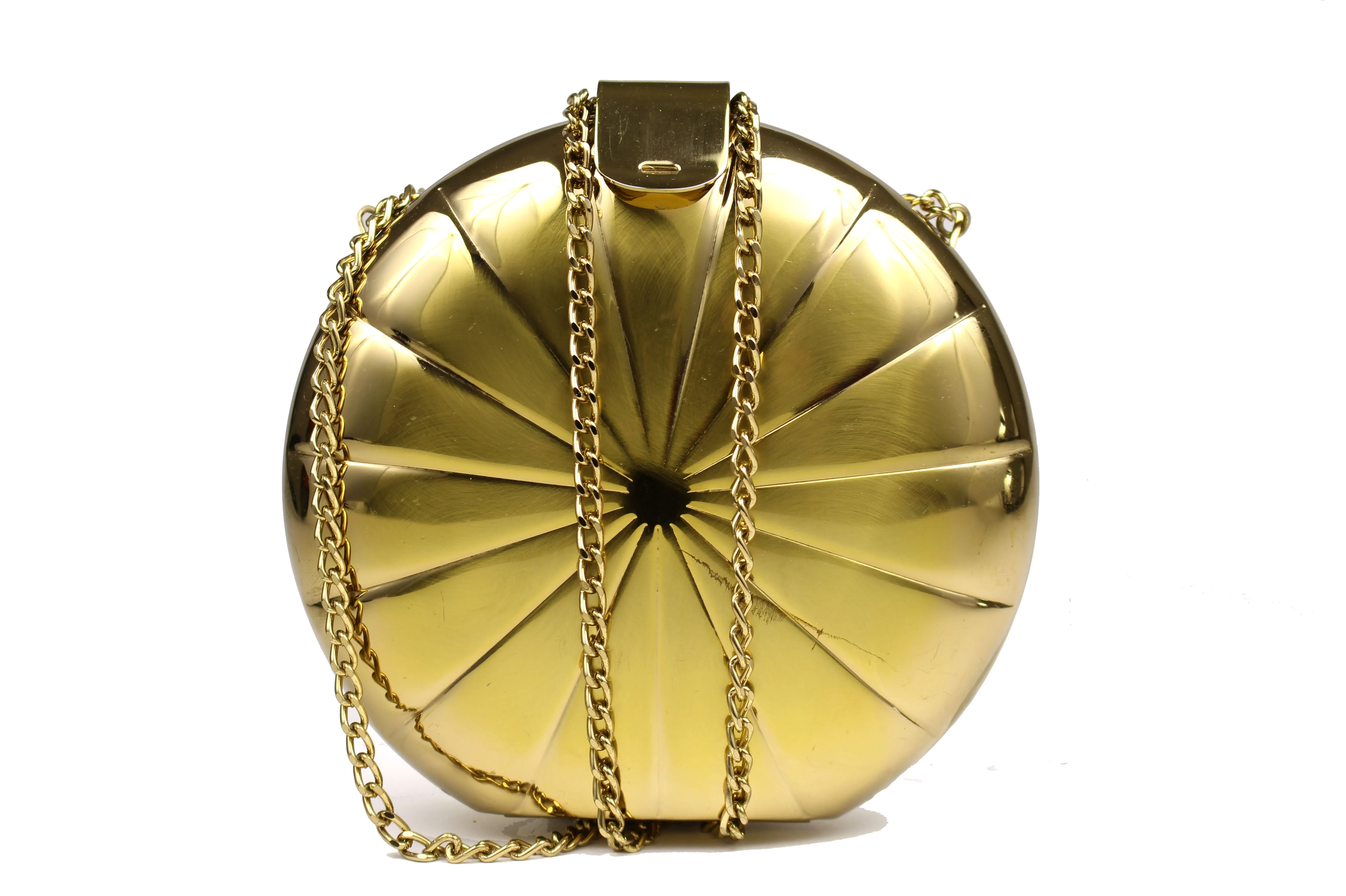 Metallic gold circular clutch with radial embossing